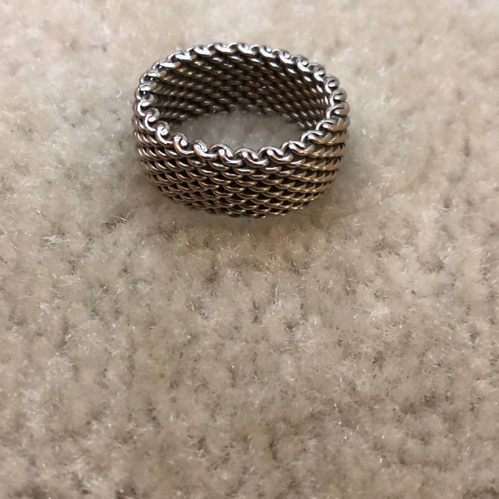 Silver chain ring.